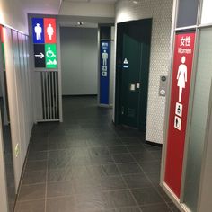 this is an image of a restroom with signs on the walls and in the floor