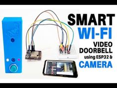 the smart wi - fi video doorbell is next to a cell phone and camera