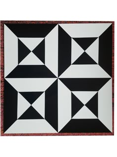 a black and white pattern with red border