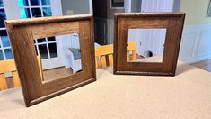 two wooden frames sitting on top of a counter