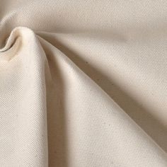 a close up view of the fabric on a plain white shirting material that is very soft