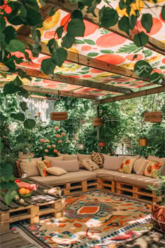 Cozy outdoor patio with colorful fabric canopy, pallet furniture with vibrant cushions, and lush greenery, creating a cheerful and inviting space. Mexican Inspired Backyard Patio, Diy Balcony Shade, Backyard Low Maintenance Ideas, Cool Backyard Ideas Creative, Diy Rooftop Ideas, Diy Patio Extension Ideas, Shaded Patio Ideas, Create Shade In Backyard, Patio Shade Ideas Diy