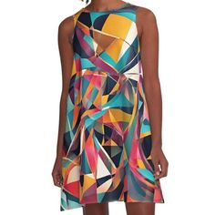 a woman wearing a colorful dress with an abstract design on the front and back side