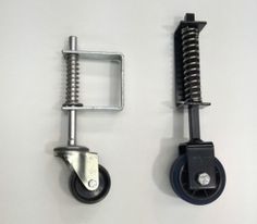 two different types of casteors on a white wall with one holding a screw and the other attached to a clamp