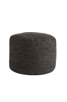 a black and grey ottoman sitting on top of a white floor