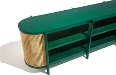 a green and gold sideboard with two shelves on each side, against a white background