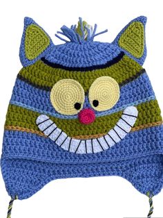 a crocheted hat with a cat's face on it