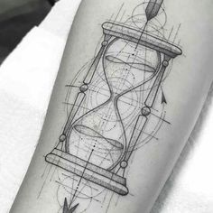 a tattoo with an hourglass on the arm