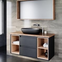 a bathroom with a sink, mirror and cabinet in the corner on the wall next to it