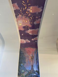 an artistic mural on the ceiling of a building with lights in the sky above it