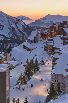 an aerial view of a ski resort at sunset