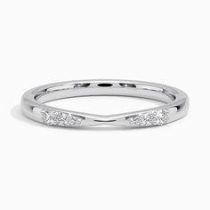 a white gold wedding band with three diamonds