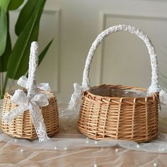 two wicker baskets with bows and ribbons