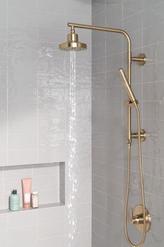 a shower head with thermostaer and soap dispenser on it