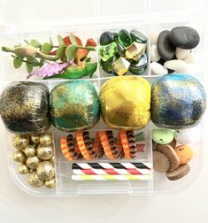 a plastic container filled with lots of different types of candy