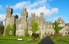 an old castle with lots of windows and ivy growing on it