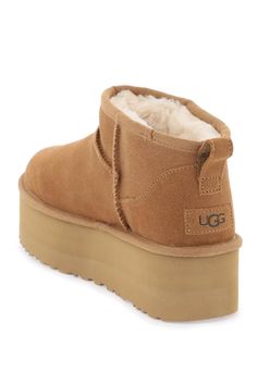 UGG Classic Ultra Mini boots crafted in stain and water resistant suede leather with raised stitching, UGGplush lining, leather patch with debossed logo applied on the heel and rear loop. SugarSole platform rubber sole. Composition: 100% leather Ultra Mini Boots, Mini Boots, Ugg Classic Ultra Mini, Zegna Shoes, Sheepskin Boots, Saint Laurent Shoes, Ugg Classic, Platform Ankle Boots, Gorgeous Bags