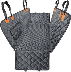 three pieces of car mats with orange tags on the handles and straps, all lined up together