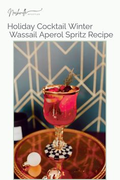 holiday cocktail winter wassail aperoli spritz recipe on a table