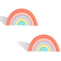 two rainbow shaped objects sitting on top of each other