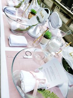 the table is set up with dishes and napkins for guests to enjoy their meal