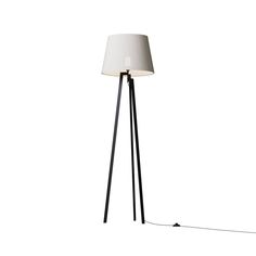 a floor lamp with a white shade on the top and a black pole underneath it