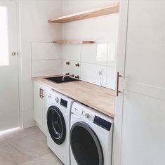 a washer and dryer in a small room