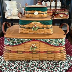 three wicker baskets stacked on top of each other in front of a coffee table