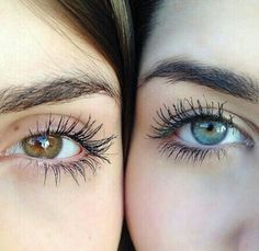 two women with long eyelashes are looking at the camera