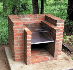 an outdoor brick pizza oven sitting on top of a cement slab