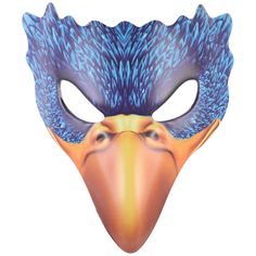 a bird mask with blue feathers on it's face and an orange beak in the center