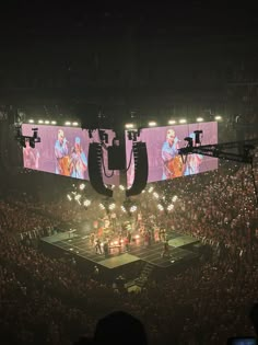 an image of a concert being played on the big screen