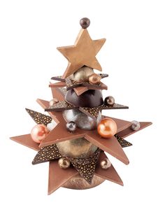 a small christmas tree made out of metal stars and other decorations on top of it