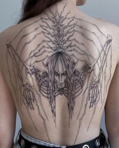 the back of a woman with tattoos on her body