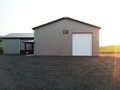 two garages in the middle of an empty lot