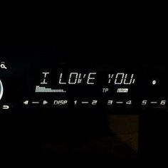 an old radio with the words i love you written on it's display screen