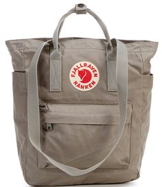 From Fjallraven&#x2C; the Kanken Convertible Totepack Backpack features: Vinylon F: 100% vinylal A tote version of Fjällräven’s iconic backpack from 1978Can be carried on the shoulder or as a backpackMade from hardwearing&#x2C; water-resistant Vinylon F fabricTop-loaded zippered main compartmentInside 13" laptop/tablet sleeve with padded baseIncludes a seat pad stored in an inside pocket in the back of main compartmentWebbing shoulder strap Fjallraven Kanken Backpack Rei, Fjallraven Kanken Inside Backpack, Cheap Casual Backpack For Trips, Fjallraven Kanken Kawaii, Kanken Mini Whats In My Bag, Cheap Themed Backpack For Travel, Fjallraven Kanken Backpack Cheap, Affordable Everyday Bags By The North Face, Fjallraven Kanken Backpack Fog Pink