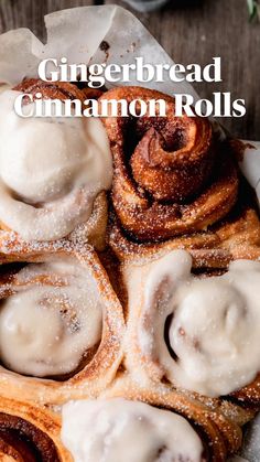 cinnamon rolls with icing and powdered sugar on top