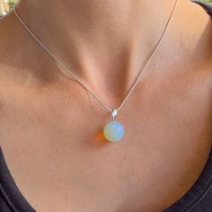 "Opalite Necklace - Birthstone October - Opalite Silver Necklace - Libra Birthstone - Chakra Healing Stone - Dainty Opalite - Delicate choker 1 pc. necklace with silver chain and single bead 14mm opalite.  Pendant size is 1 inch / 2 cm Gemstones characteristics and metaphysical properties: Opalite: Birthstone October, Star sign - Libra Mysterious stone, with can increase our ability to protect ourselves. This is known to be the ''friendship\" stone, so it is suitable for a gift. It neutralized negative emotions like grief, sadness, jealousy, and selfishness. Free gift box: You will receive this necklace in a beautiful gift box with cushion inside! Let me pleasantly surprise your loved ones on your behalf if it's a gift! If you need a special handmade jewelry - something unique or just have October Star Sign, Libra Birthstone, Libra Star Sign, Opalite Necklace, Chakra Healing Stones, Delicate Choker, Necklace Birthstone, Single Bead, 925 Sterling Silver Chain