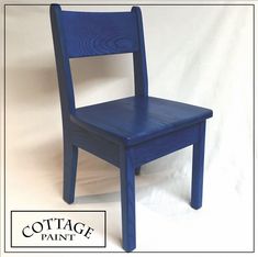 a blue wooden chair with the words cottage paint on it's bottom and bottom