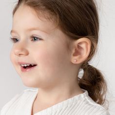 Your little girl will look precious with these adorable baby earrings made of 14k gold which are suitable for sensitive ears. Featuring a cute daisy flower colored with bright enamel colors, leading to a post with safety screw backs for children. These gold flower earrings make a perfect gift for any special occasion such as holidays or birthdays. A complimentary gift box is included for your convenience. Age Group: Adorable for Babies, Infants & Toddlers or Little Girls; Safe for Sensitive Skin Baby First Earrings, Baby With Earrings Children, Earrings For Baby Girl, Toddler Clip On Earrings, Baby Girl Earrings, Toddler Earrings, Gold Flower Earrings, Baby Earrings, Kids Earrings