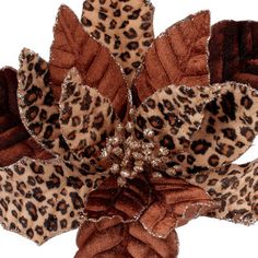 Bring the jungle to your holiday decorations with this 24” Cheetah Print poinsettia stem set of 4, crafted of velvet with gold glitter trim. Perfect for filling your Christmas tree and wreaths with a wild accent, the wired stems make it easy to twist the stems into your favorite creations. Blow with canned air for cleaning, over all measures 24”H x 9”W x 5”D. the stems ship compressed and must be primped and styled to match the image shown The Holiday Aisle® | The Holiday Aisle® Jayace Christmas Animal Print Christmas Decor, Leopard Christmas Decor, Cheetah Print Christmas Tree, Safari Christmas, Animal Print Furniture, Leopard Christmas Tree, African Christmas, Leopard Christmas, Christmas Picks