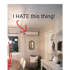 a room with a table, chair and mirror in it that says i hate this thing