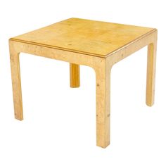 a square wooden table with one leg bent down and the other end turned slightly to the side