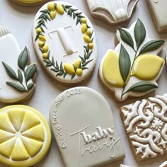 many decorated cookies are arranged on a table