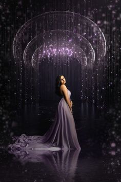 a woman in a long purple dress is standing in the rain with her hands on her hips