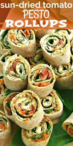 an image of sun dried tomato pesto roll ups on a platter with text overlay