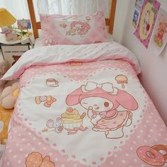 a bed with pink and white polka dot bedspread, teddy bear pillow cases and stuffed animals