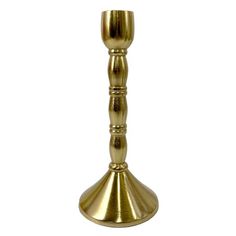 a gold colored candle holder on a white background