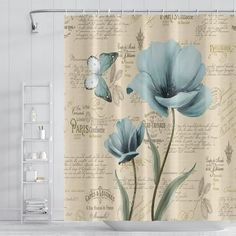 a shower curtain with blue flowers and butterflies on it